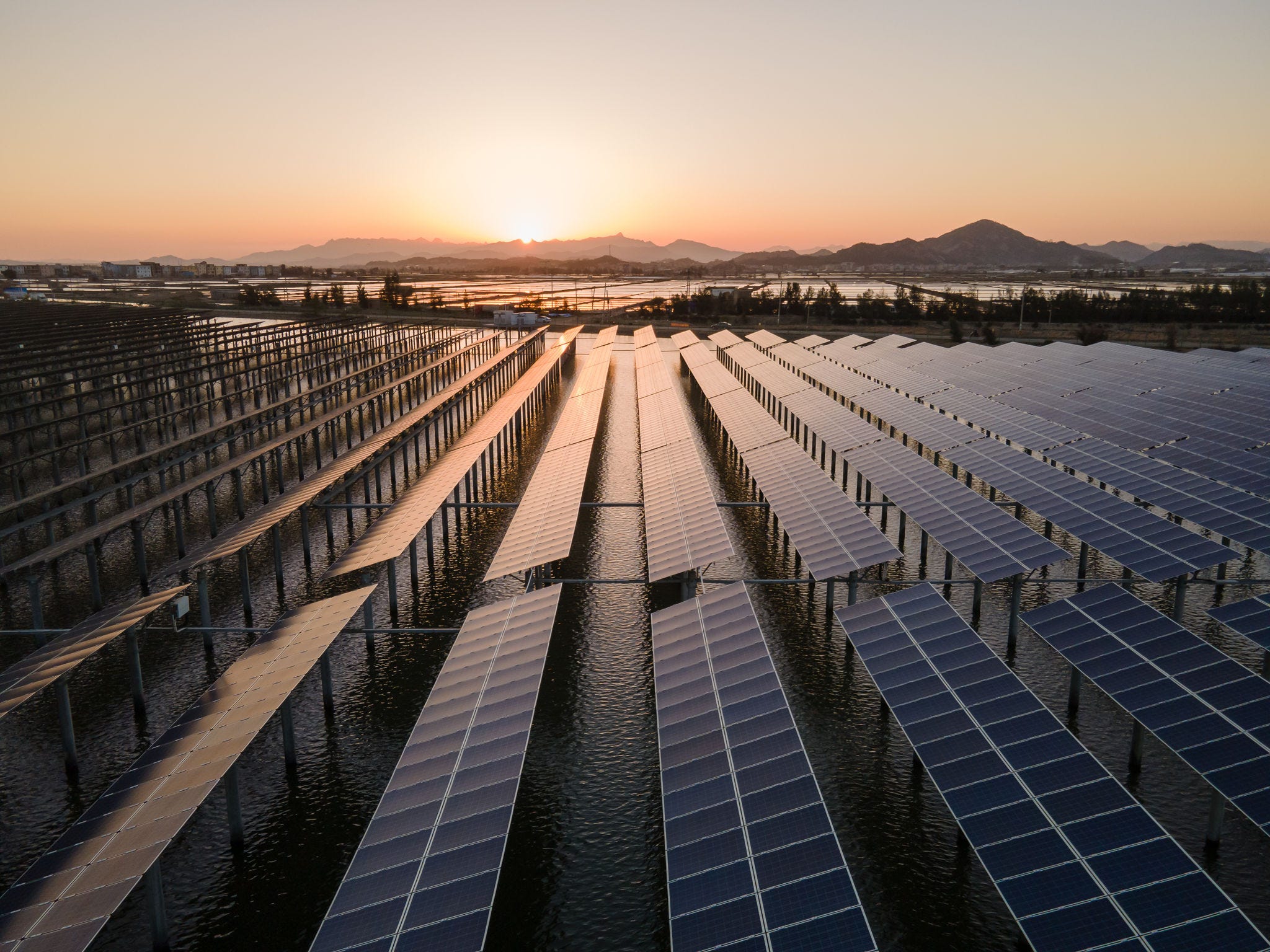 Early in the morning, the photovoltaic power station by the sea